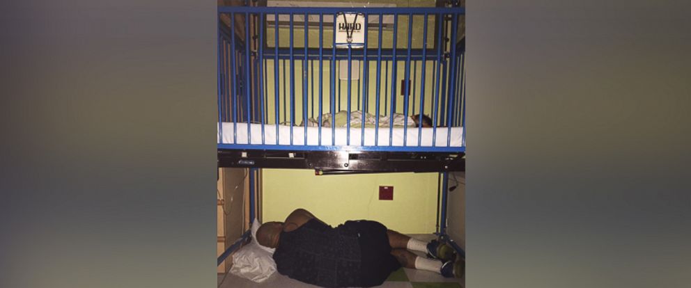 Father Falls Asleep Under Sick Sons Crib At The Hospital In