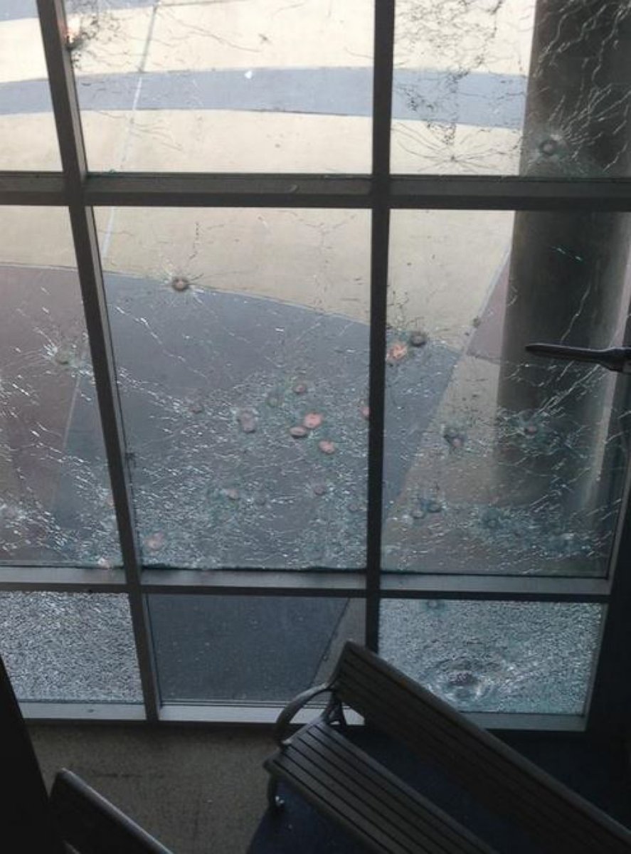PHOTO: This photo, provided by the Dallas Police Department, shows the damage to police headquarters after a shooting on June 13, 2015.