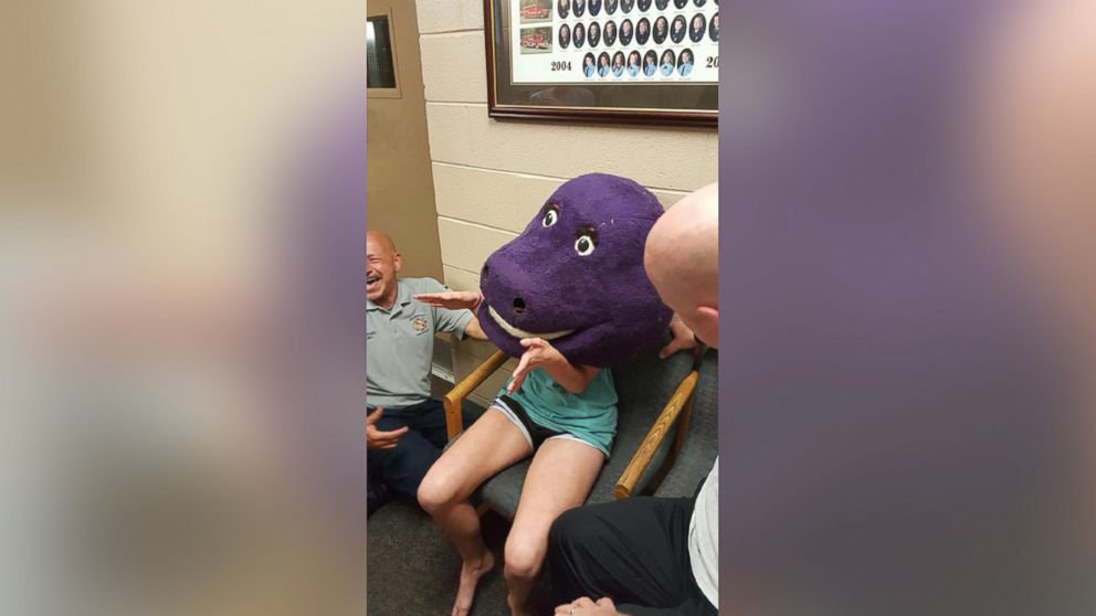 Firefighters in Trussville, Aalabama, helped 15-year-old Darby Risner get out of a giant 'Barney' head she got stuck inside of on June 19, 2016.