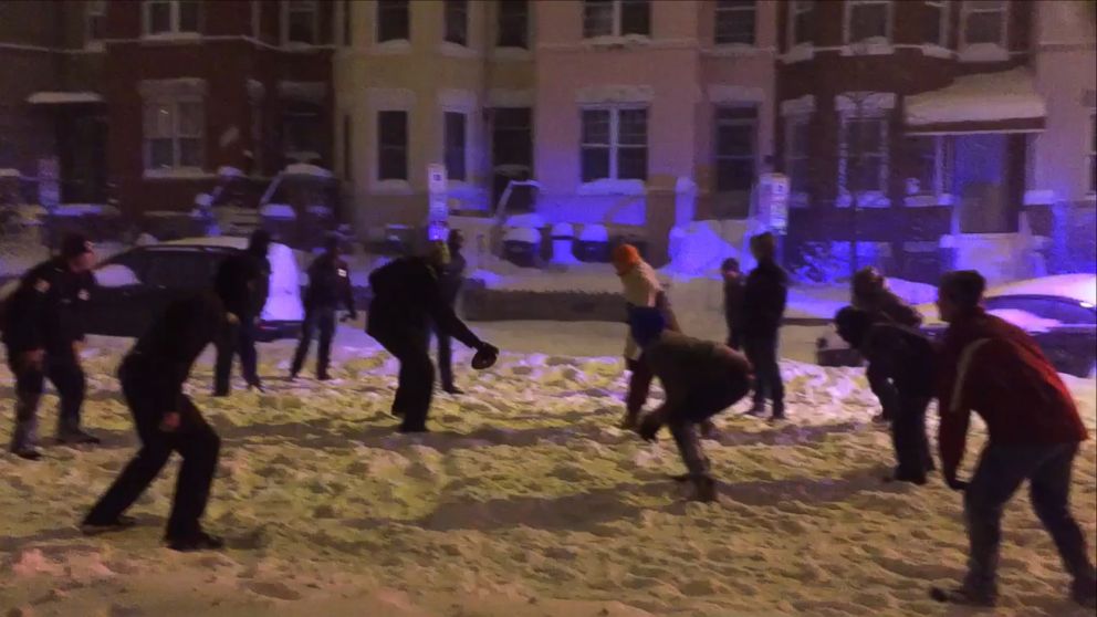 This still from a Twitter video posted Jan. 23, 2016, shows some Washington, D.C. officers taking part in a pickup football game amid a powerful blizzard that swept the East Coast. 