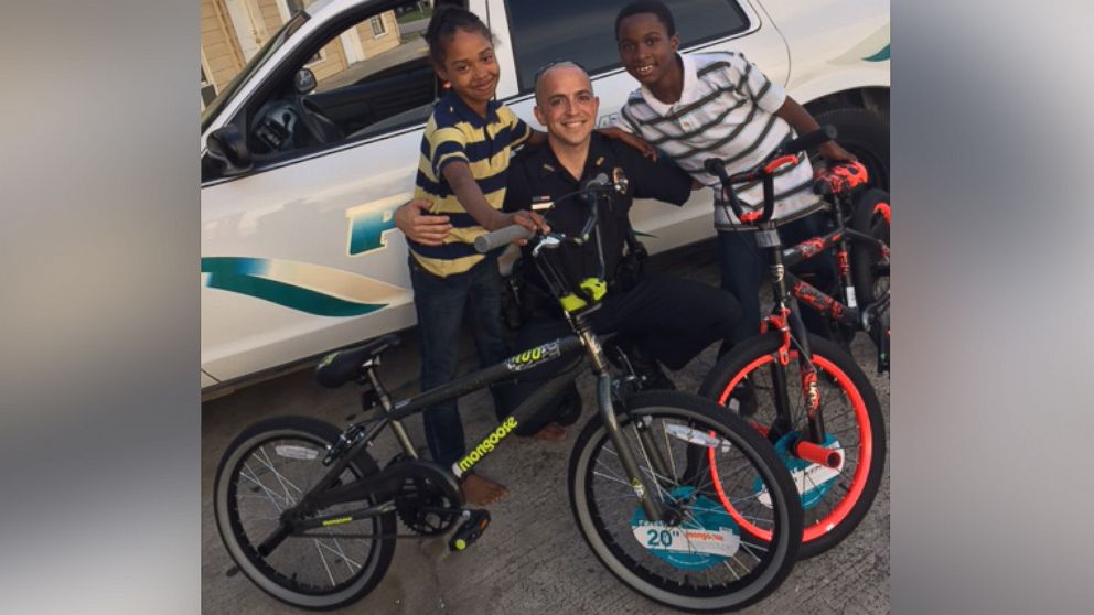 Officer Timothy Bachot gave siblings Gwendolyn and Anthony bicycles after they thanked him for his service to the community.