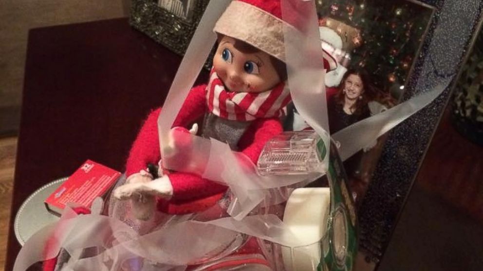 An "Elf on the Shelf" poses for a portrait.