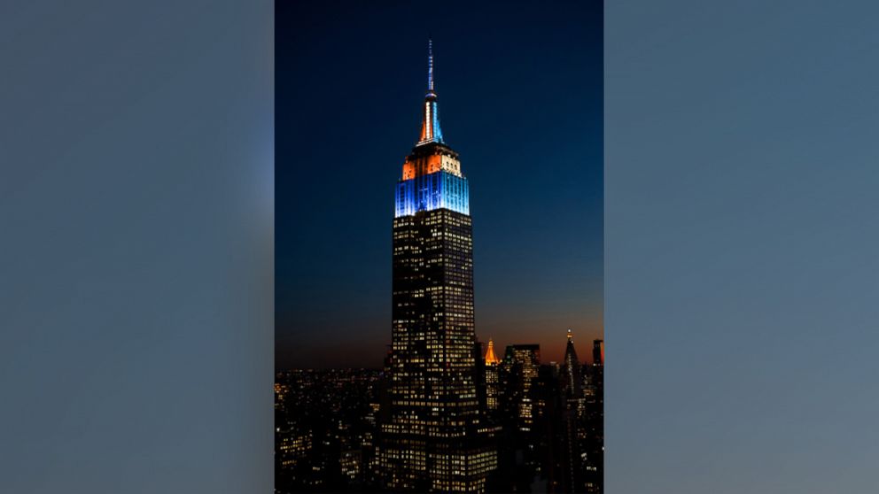 The Empire State Building lit in Denver Broncos and Carolina Panthers colors.