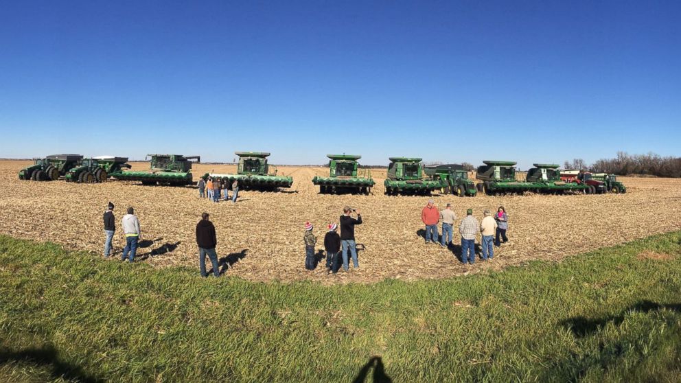 PHOTO:Members of the Lennox, South Dakota farming community come together to complete the harvest of Dave Klinghagen, who passed away suddenly. 