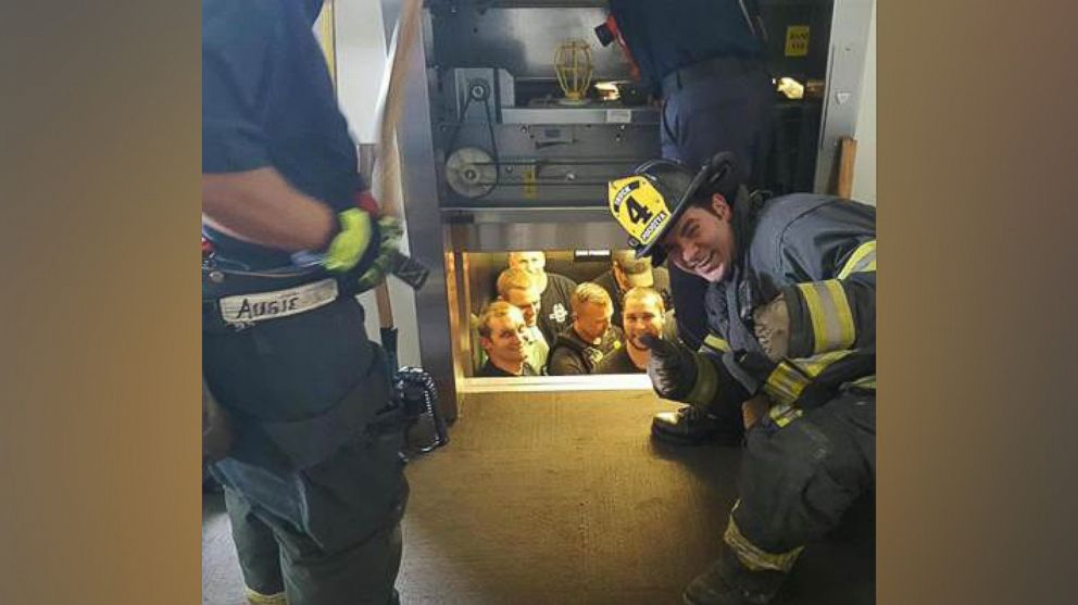 A dozen Kansas City police officers were rescued Wednesday afternoon after getting stuck in an elevator, officials said.