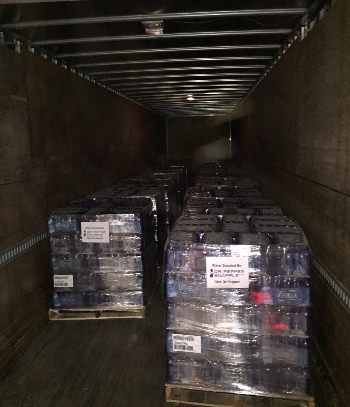 PHOTO:Dr Pepper Snapple Group donates 41,000 bottles of water to Flint, Michigan at woman's request in exchange for her @DietDrPepper Twitter account. 