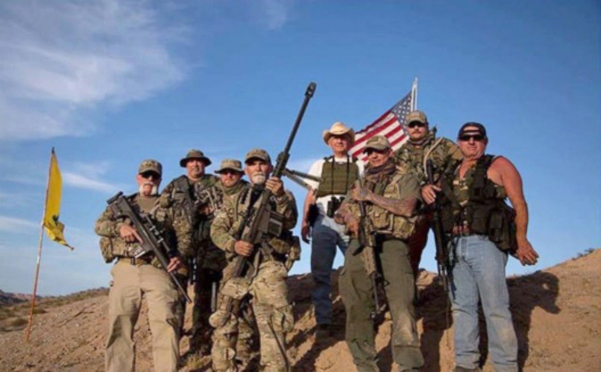 PHOTO: Gerald Delemus, center, is seen holding a .50 caliber machine gun in this undated photo. 