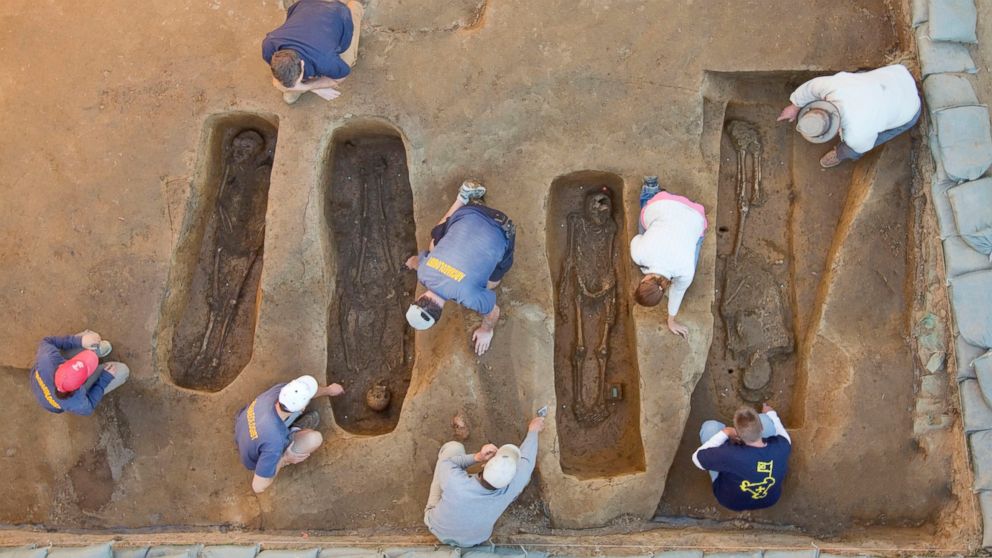 Overview of the chancel burial excavations. Archaeologists (from left to right) Mary Anna Richardson, Danny Schmidt, David Givens, Dan Smith, Don Warmke, Jamie May, Dan Gamble, and Dr. William Kelso. 