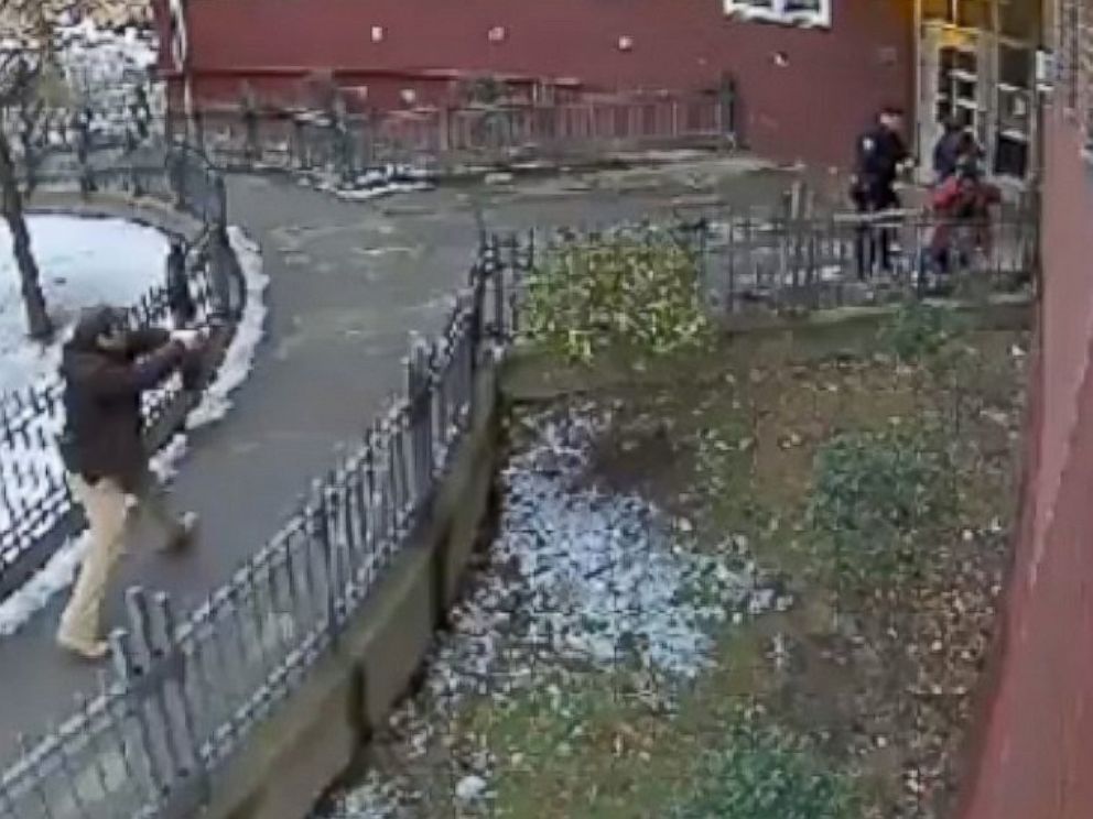 PHOTO: Surveillance video from December 2013 shows police officers in plain clothes approaching then 15-year-old Keston Charles with their guns drawn outside his Brooklyn apartment building.