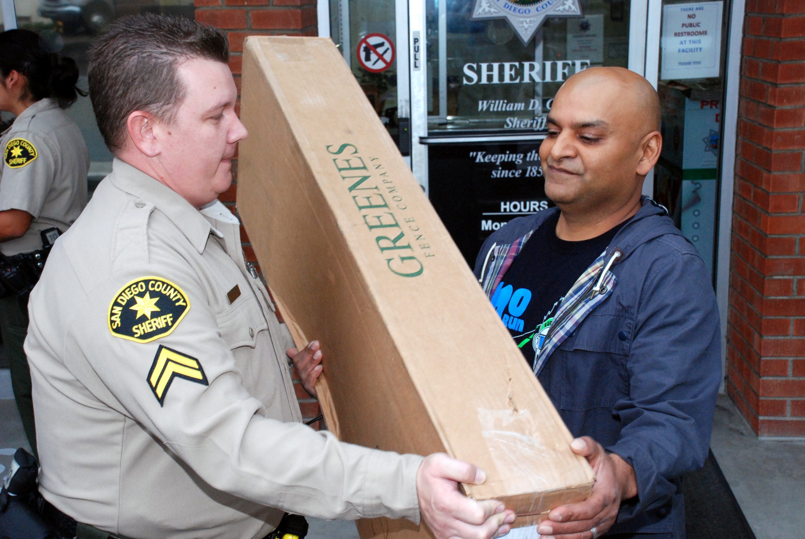 PHOTO: A victim is seen picking up his stolen package from a San Diego County Sheriff from the storage unit.