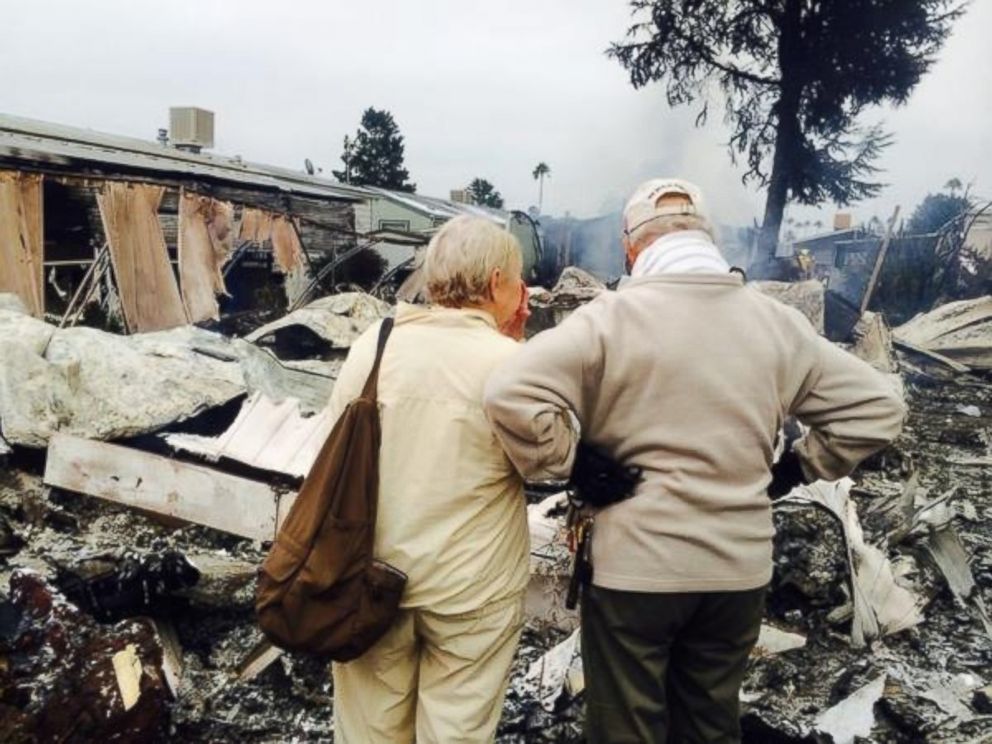 PHOTO: Laura Anthony posted this photo to Twitter with the caption "Napa couple looks at the remains of mobile home they own with their son. One of 4 completely destroyed by fire." on Aug. 24, 2014.
