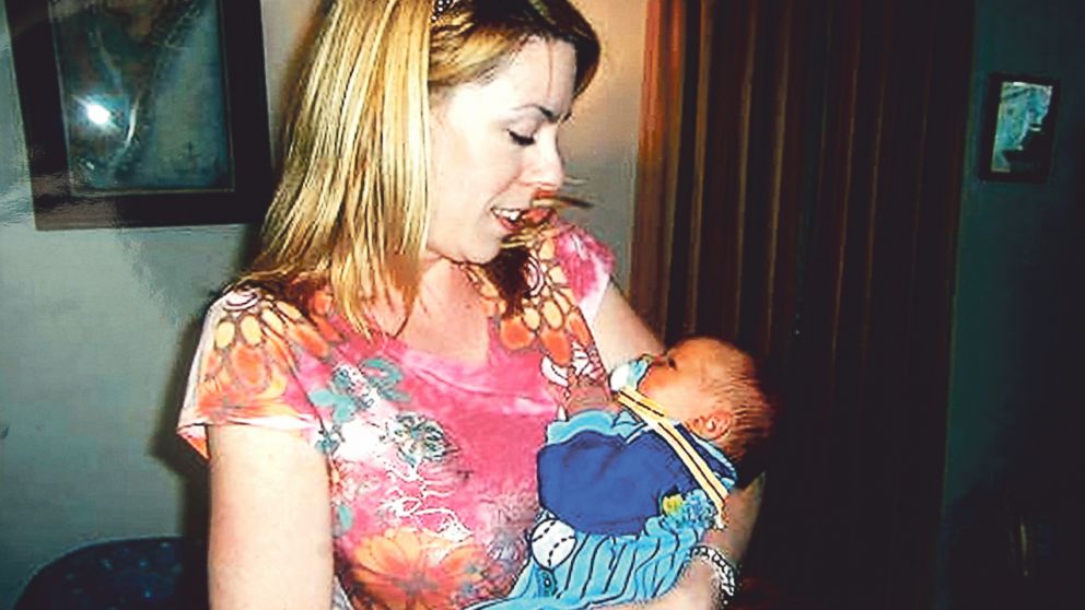 Lucy Johnson, who was found dead on July 18 2008, holds her son.