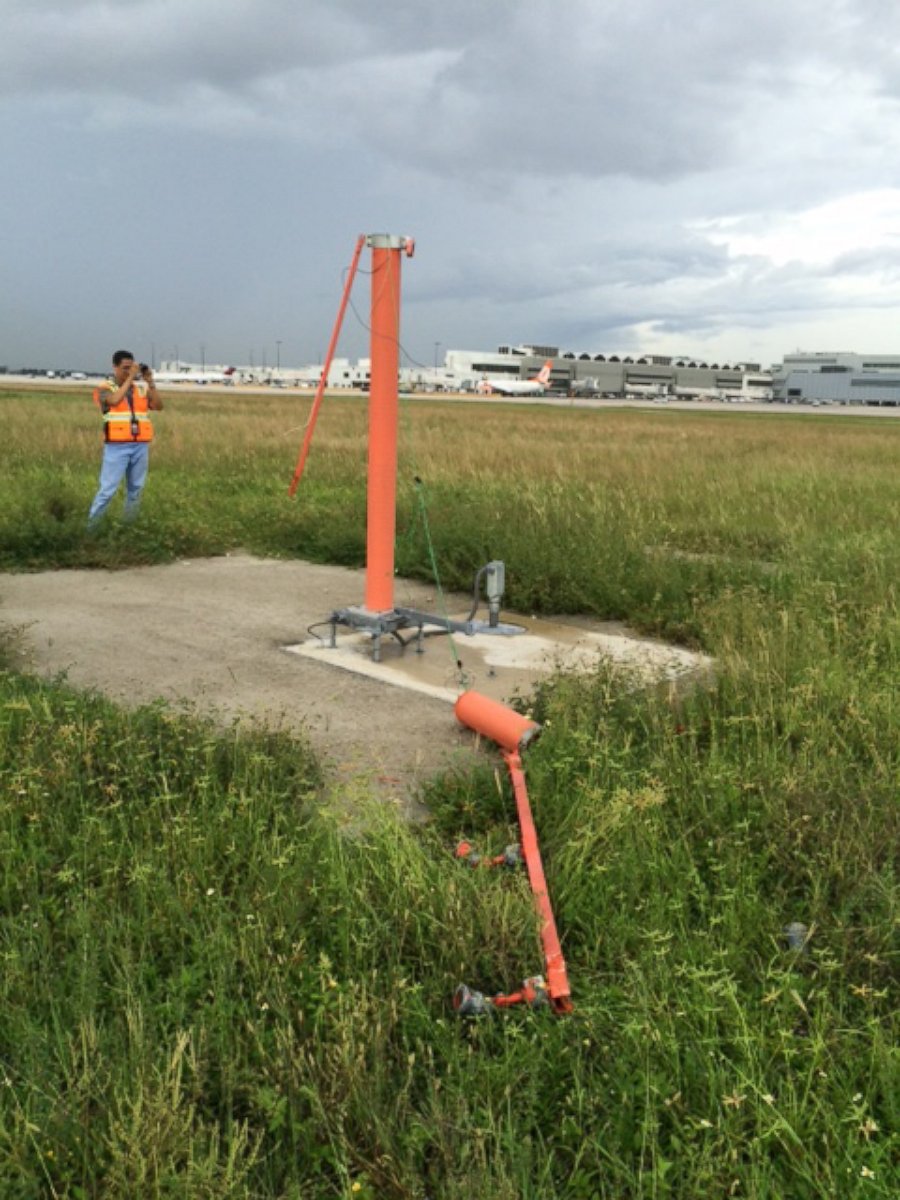 PHOTO: An agent discovered three downed poles at the end of Miami Airport's Runway 9. 