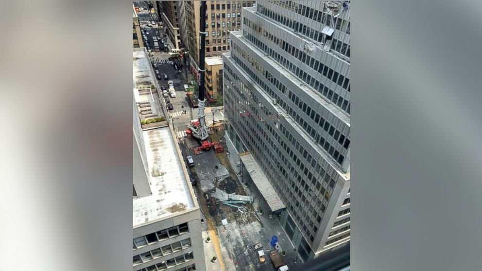 @nickgenes posted this photo on Twitter on May 31, 2015 with the caption, "Crane accident just now at 38 & Madison - apparently no one hurt, a few cars hit by building debris."