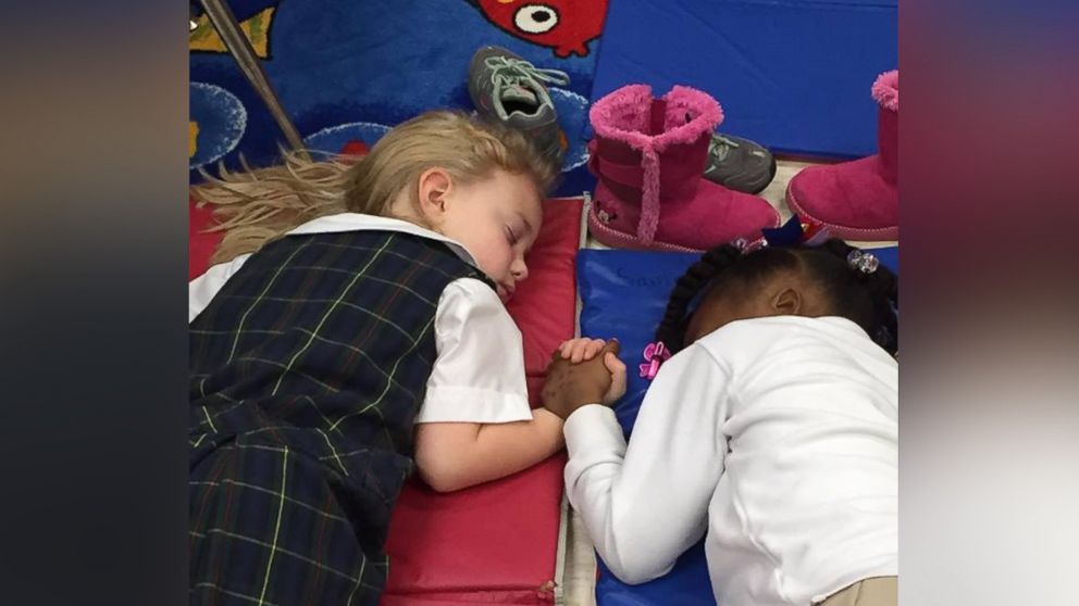 A teacher captured a tender moment in a photo taken during two kindergartners' nap time at Presbyterian Day School in Clarksdale, Mississippi.