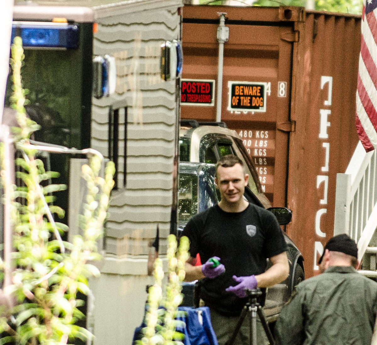 PHOTO: Police begin dismantling a shipping container outside the Gorham, NH home of Nathaniel Kibby 