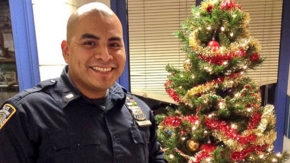 Officer Carlos Ramos, 31, gives back to the community, Dec. 17, 2015, in New York City.