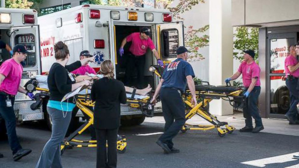 PHOTO: Paramedics tend to injuries after being called to an active shooter at Umpqua Community College in Roseburg, Oregon, Oct. 1, 2015.