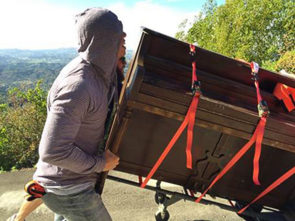 PHOTO: L.A. "mystery piano" being hauled up a hillside.