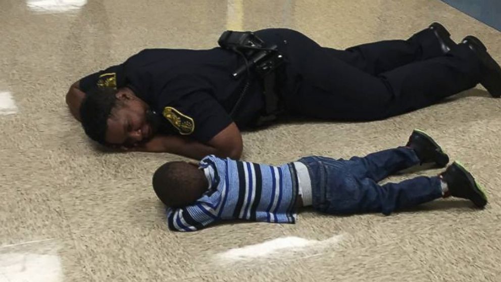 PHOTO: Indianapolis State Officer Precious Cornner-Jones lay on the floor of a public school for a few minutes to comfort a 4-year-old boy who was having a bad day.