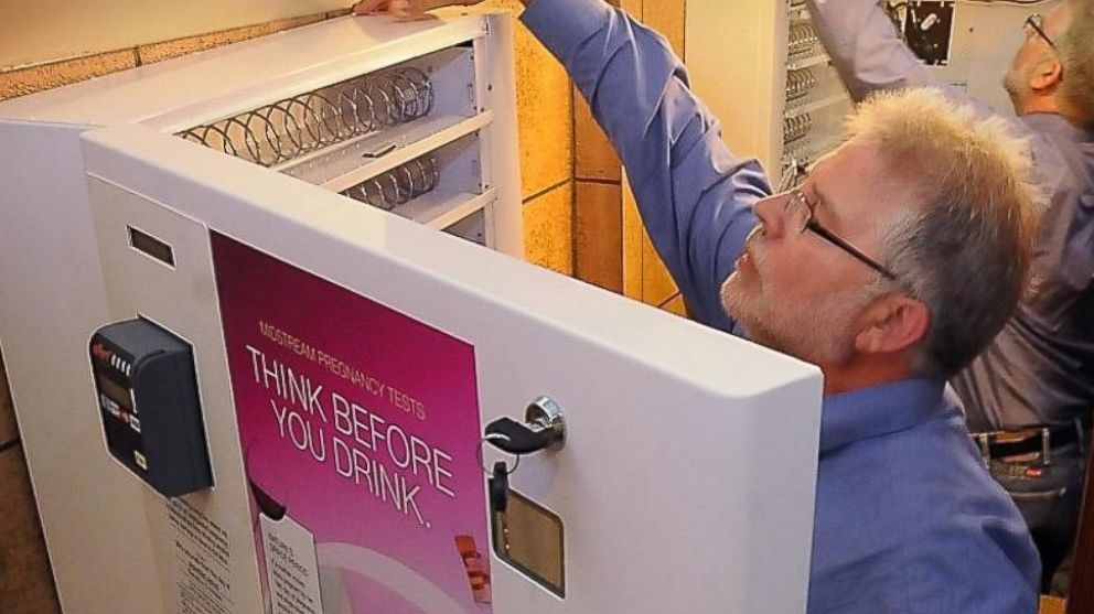 PHOTO: Jody Allen Crowe, executive director of Healthy Brains for Children, installed the first-of-its-kind pregnancy test dispenser in the women's restroom at Pub 500 in Mankato, Minn. in 2012.