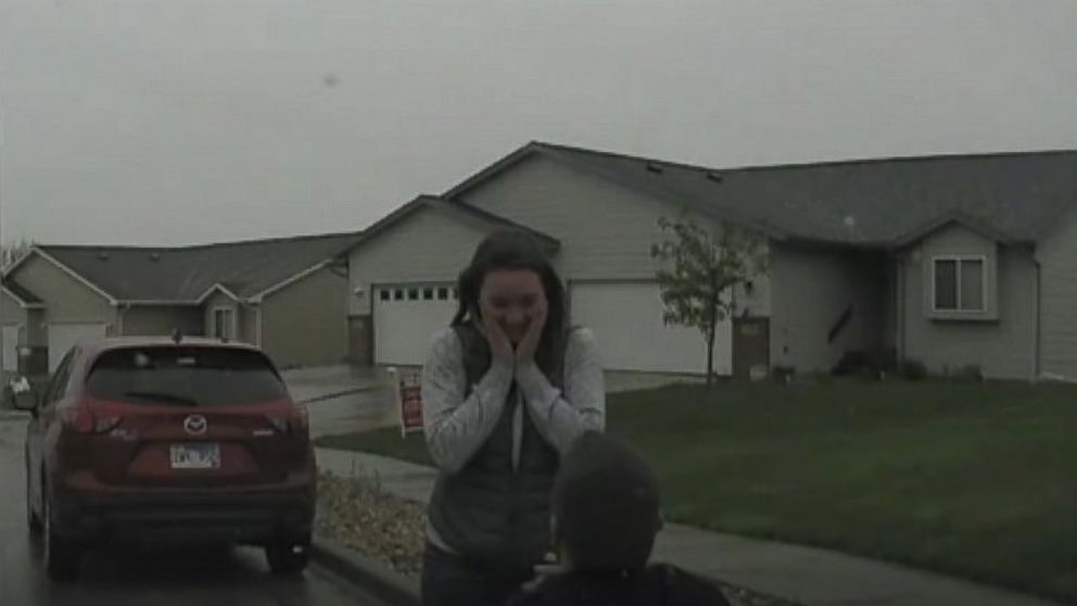Rapid City Police Department posted video to Facebook on April 28, 2016 with the caption, "This one is too good not to share! With the help of his partner, Officer Nick Allender pulls off a surprise proposal to his girlfriend, Sarah Stewart. She's a Firefighter/Paramedic for the Rapid City Fire Department."