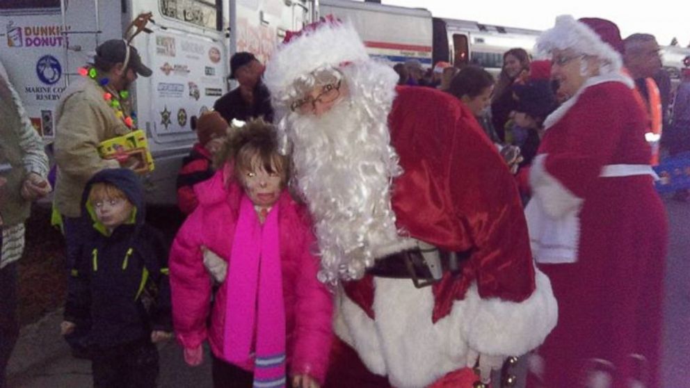 PHOTO: Safyre, 8, posed with Santa at a Toys for Tots event on Dec. 5. 
