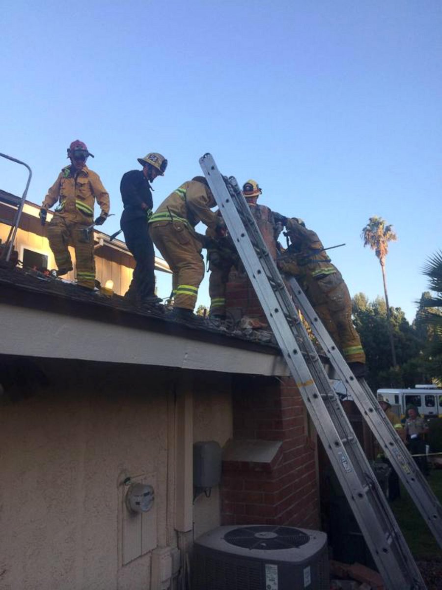 PHOTO: Firefighters rescue a woman who got stuck in a chimney in Thousand Oaks, Calif.
