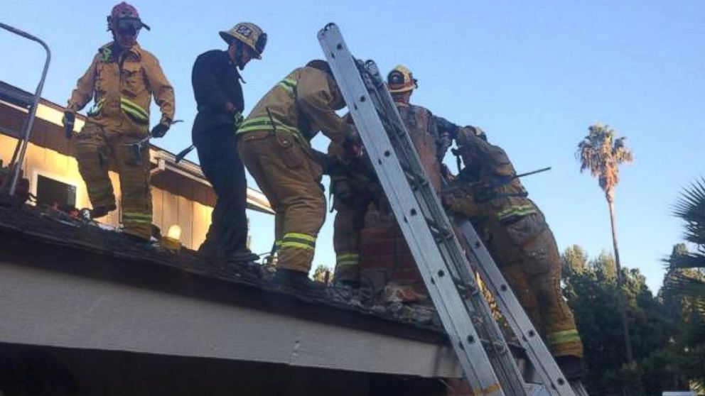 PHOTO: Firefighters rescue a woman who got stuck in a chimney in Thousand Oaks, Calif.