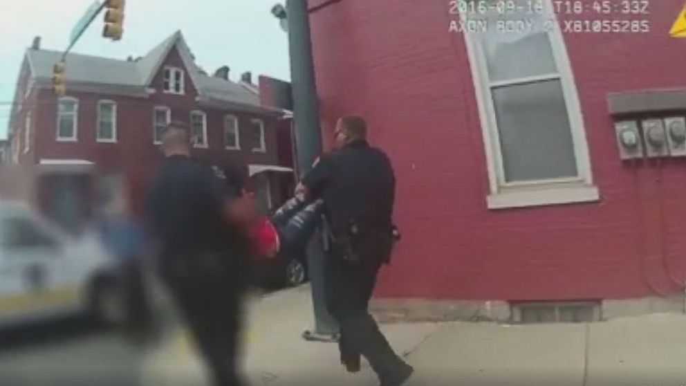 PHOTO: Hagerstown Police officers carry a 15-year-old girl who they described is uncooperative to a squad car Wednesday afternoon. 