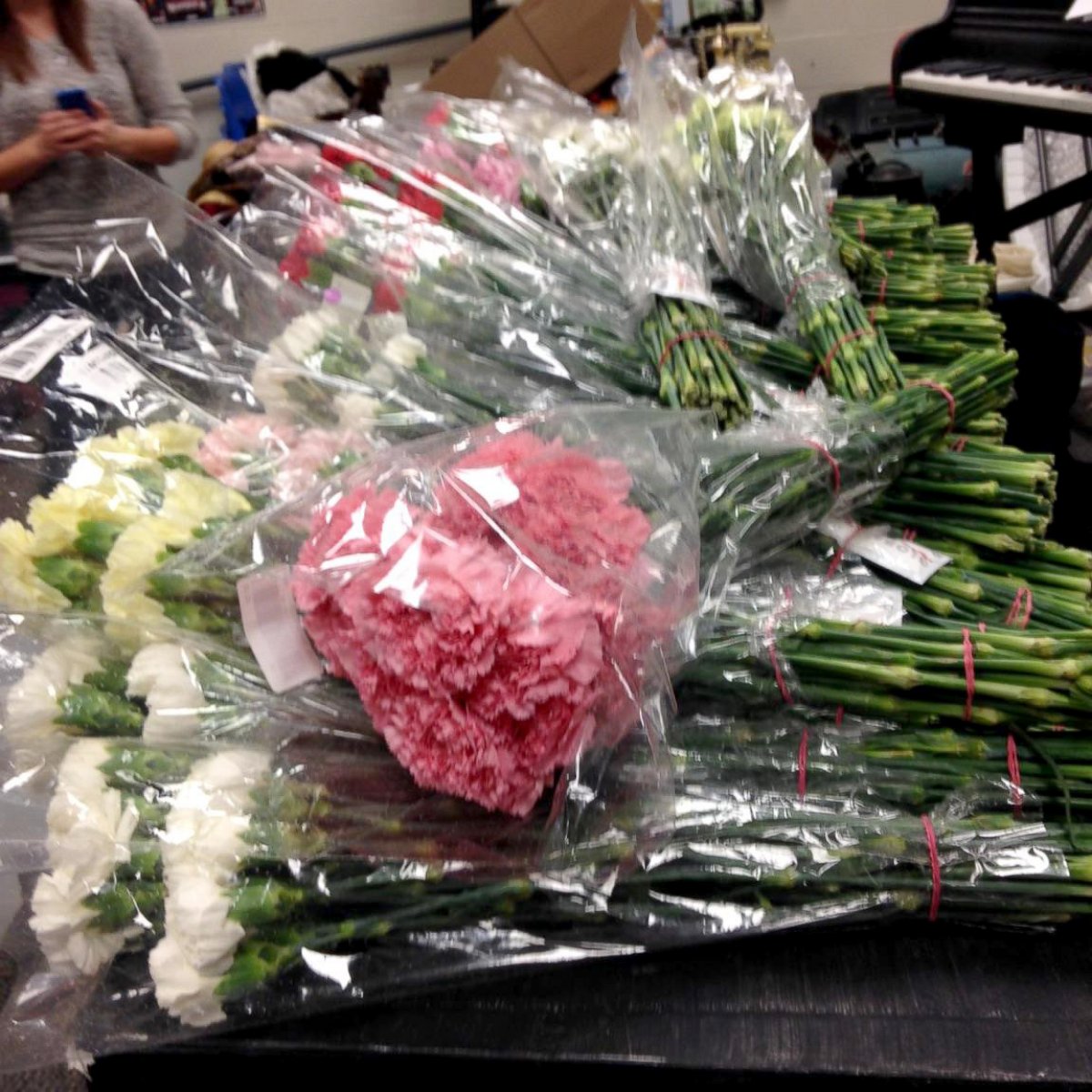 PHOTO: The high school senior bought carnations in more than six colors from an online wholesaler to hand out to every girl in school. 