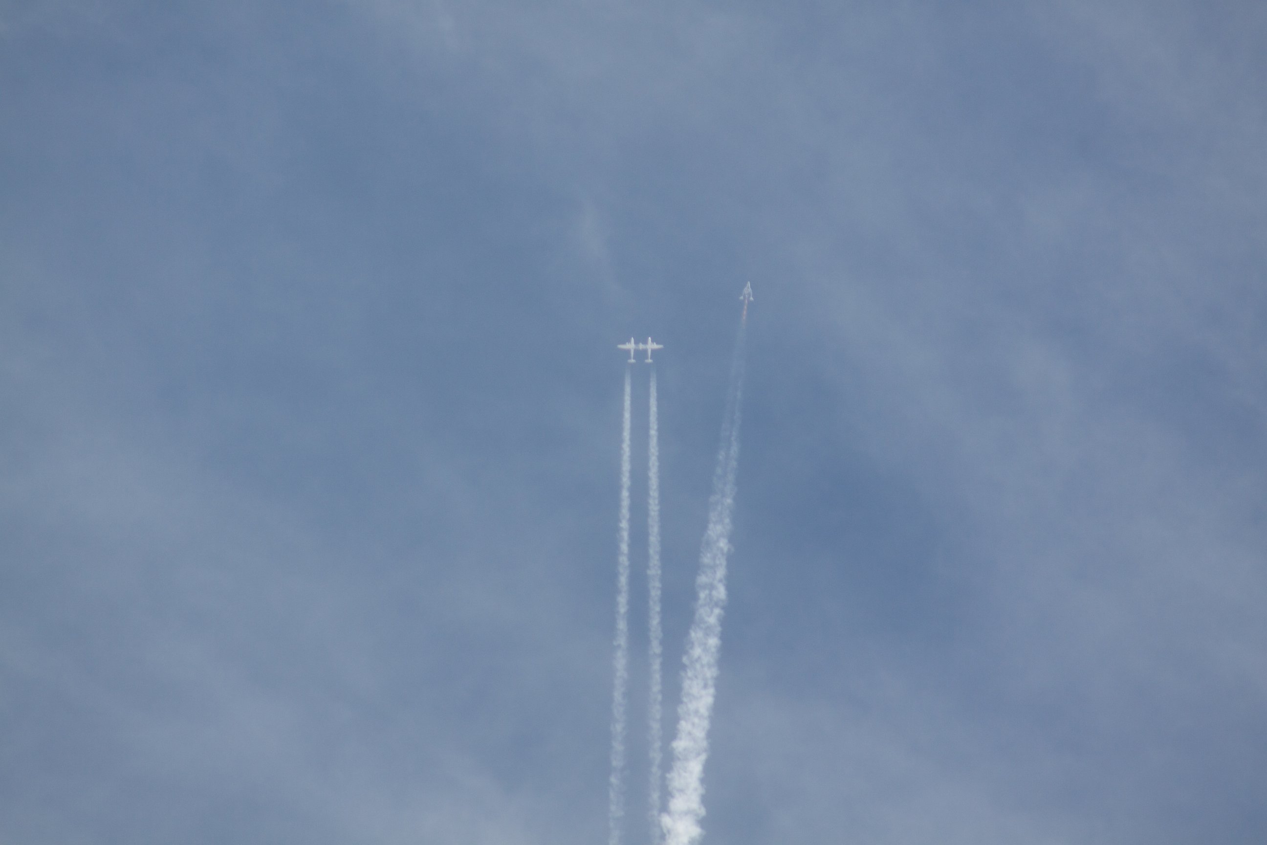 PHOTO: The Virgin Galactic spacecraft breaks up in midair as it flies over the Mojave desert