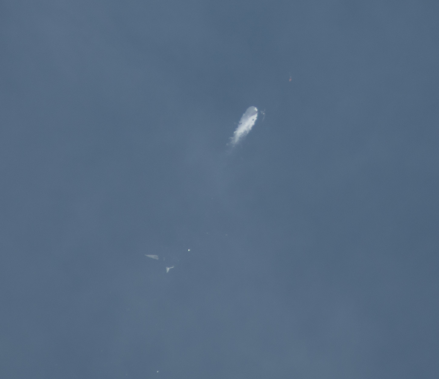 PHOTO: The Virgin Galactic spacecraft breaks up in midair as it flies over the Mojave desert