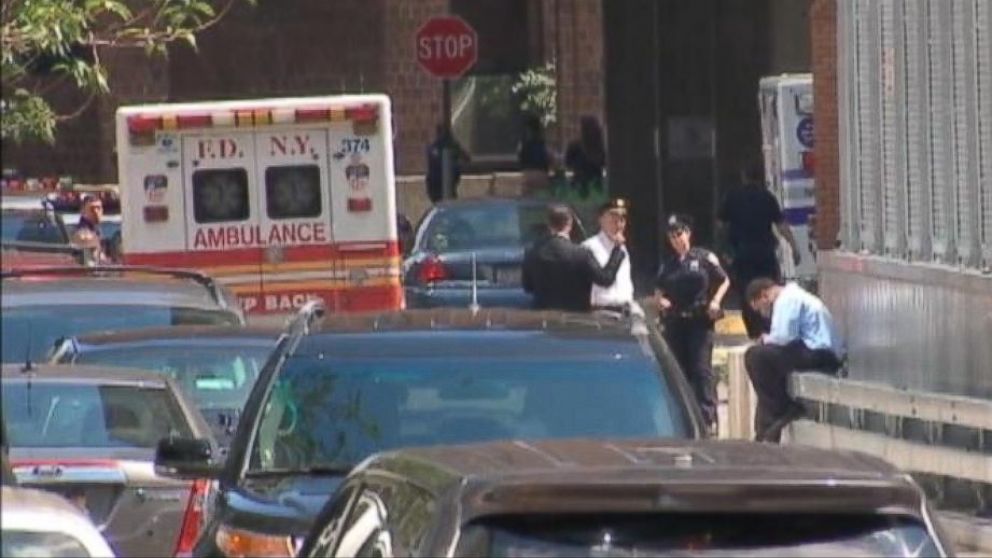 PHOTO: An ambulance sits near the scene of a fatal shooting involving a fugitive in New York City, July 28, 2014.