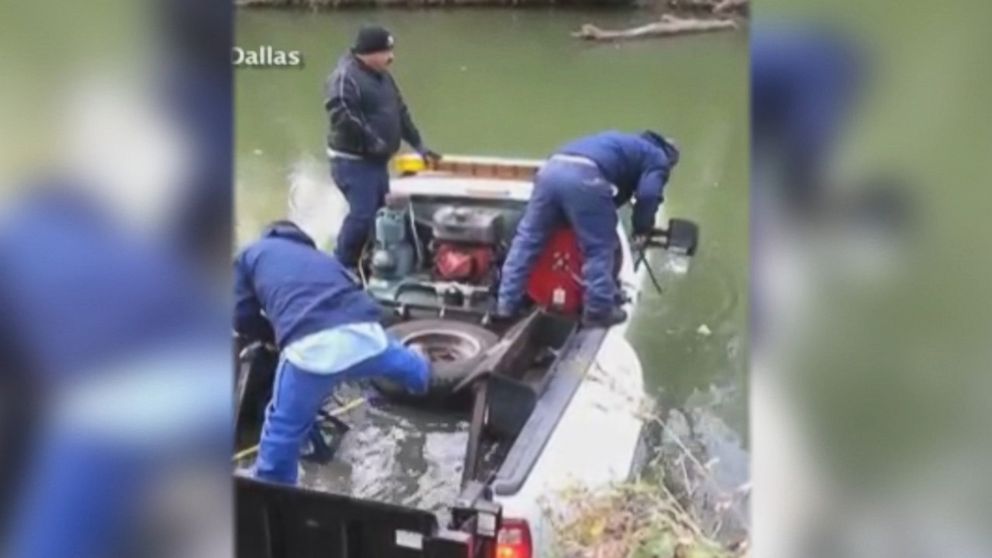 PHOTO: Two Dallas city workers helped rescue a colleague from a sinking truck.