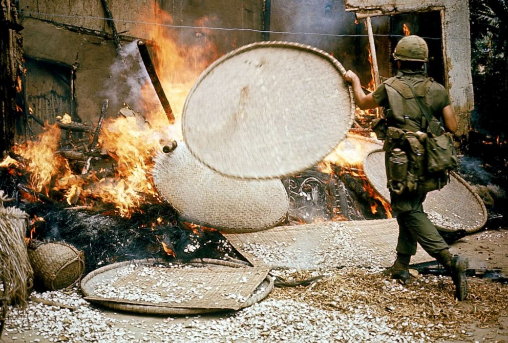 PHOTO: An American soldier burns houses during the My Lai massacre, March 16, 1968, in My Lai, South Vietnam. 