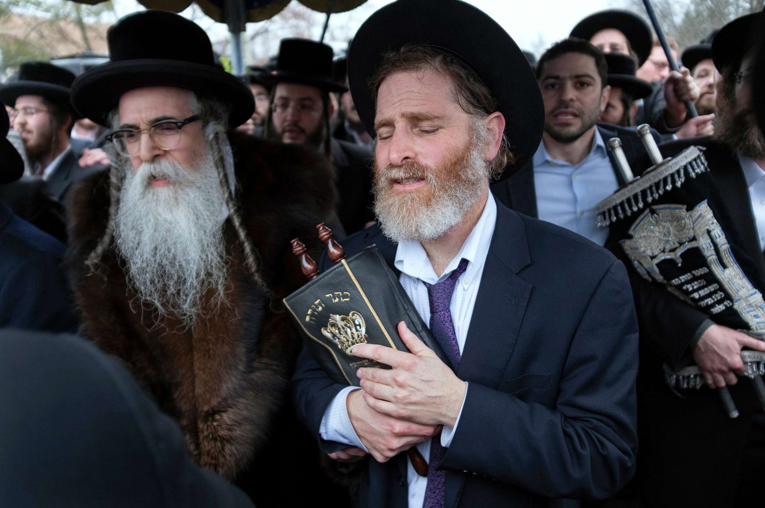 PHOTO: Community members, including Rabbi Chaim Rottenberg, left, celebrate the arrival of a new Torah near the rabbi's residence in Monsey, N.Y., Dec. 29, 2019. 