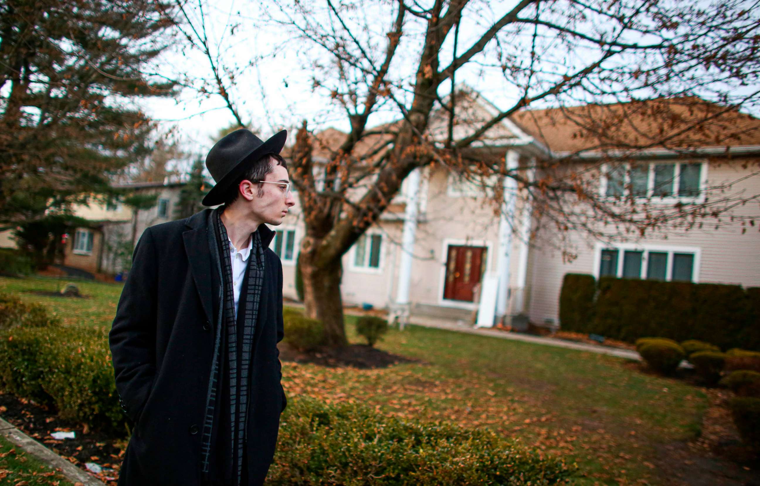 PHOTO: A man stands outside the home of rabbi, Chaim Rottenberg in Monsey, N.Y., Dec. 29, 2019, after an attack that took place earlier outside the rabbi's home during the Jewish festival of Hanukkah.