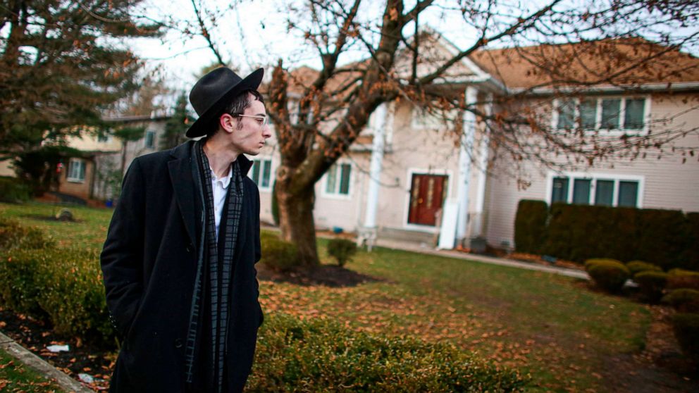 PHOTO: A man stands outside the home of rabbi, Chaim Rottenberg in Monsey, N.Y., Dec. 29, 2019, after an attack that took place earlier outside the rabbi's home during the Jewish festival of Hanukkah.