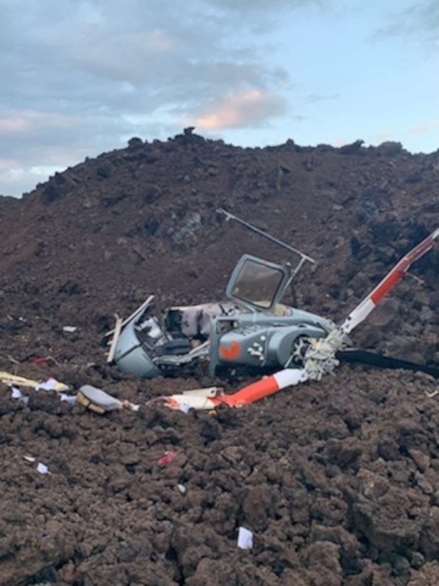 PHOTO: A tourist helicopter lies in a lava field in Kau, on Hawaii's Big Island, on June 8, 2022.