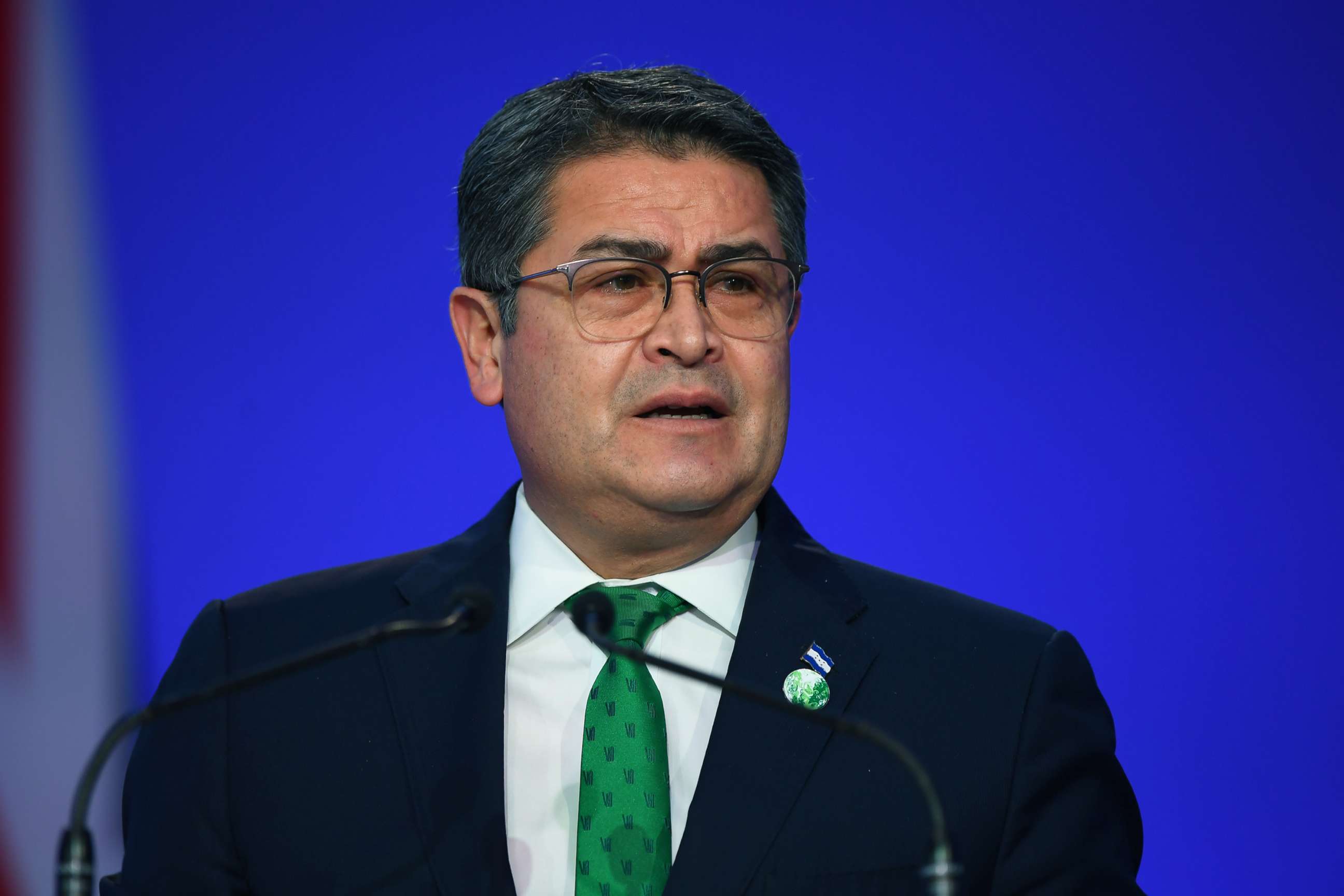 PHOTO: In this Nov. 1, 2021, file photo, Honduran President Juan Orlando Hernandez presents his national statement during day two of COP26 at SECC, in Glasgow, United Kingdom.