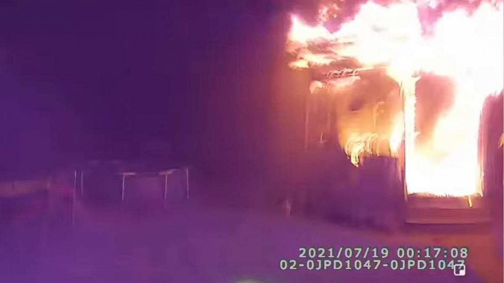 PHOTO: A cop is being hailed as a hero after footage from his body camera showed him responding to a building engulfed in flames before saving the occupants’ lives by catching them when they jumped out of a window on July 19, 2021, in Jamestown, New York.