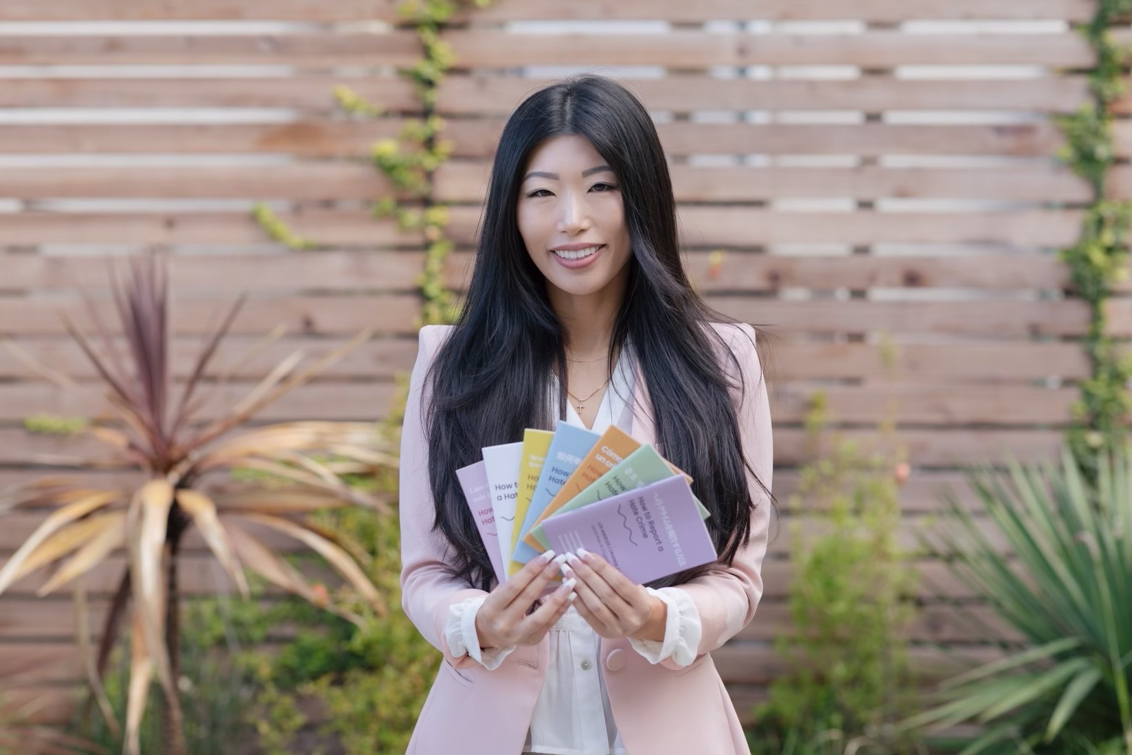 PHOTO: Esther Lim is pictured here with her "How to Report a Hate Crime" booklets. 