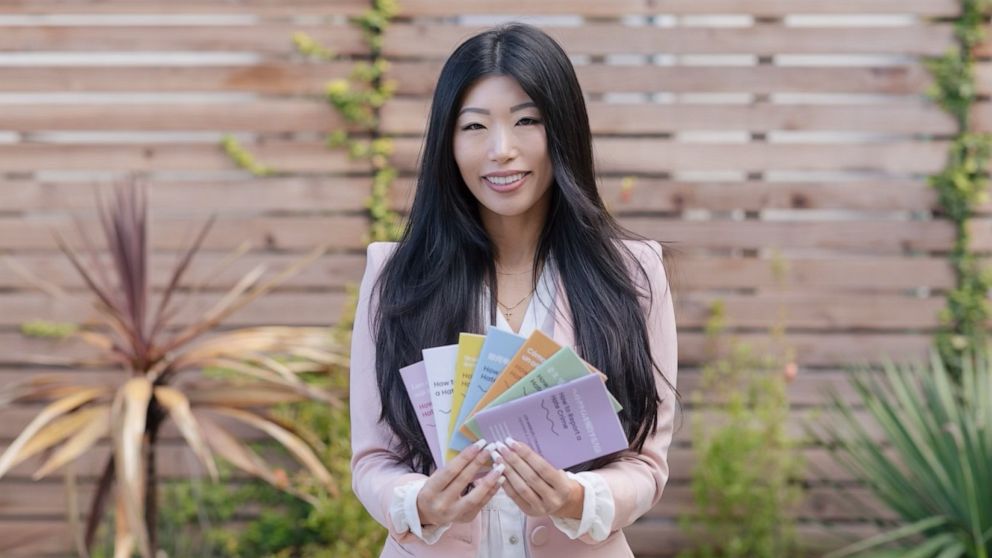 PHOTO: Esther Lim is pictured here with her "How to Report a Hate Crime" booklets. 