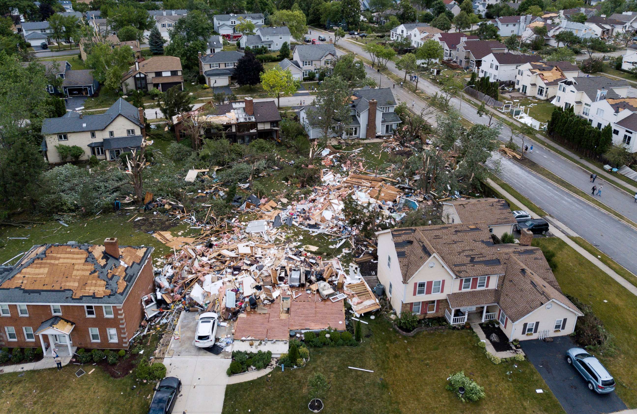 PHOTO: A home on the 1800 block of Princeton Circle is leveled after an overnight tornado swept through the area in Naperville, Ill., June 21, 2021.