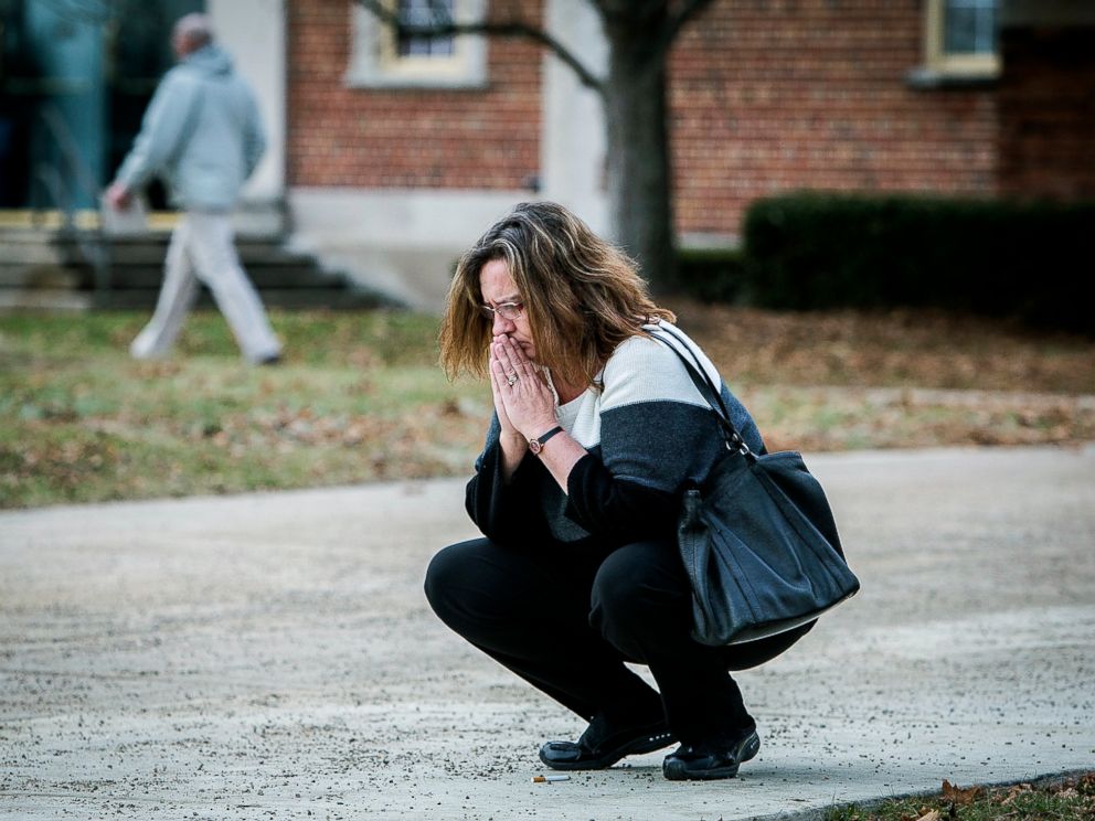 PHOTO: A parent prays outside of the Civic Hall Performing Arts Center before going inside to reunite with her child after a shooting occurred at Dennis Intermediate School, Thursday, Dec. 13 2018, in Richmond, Indiana.