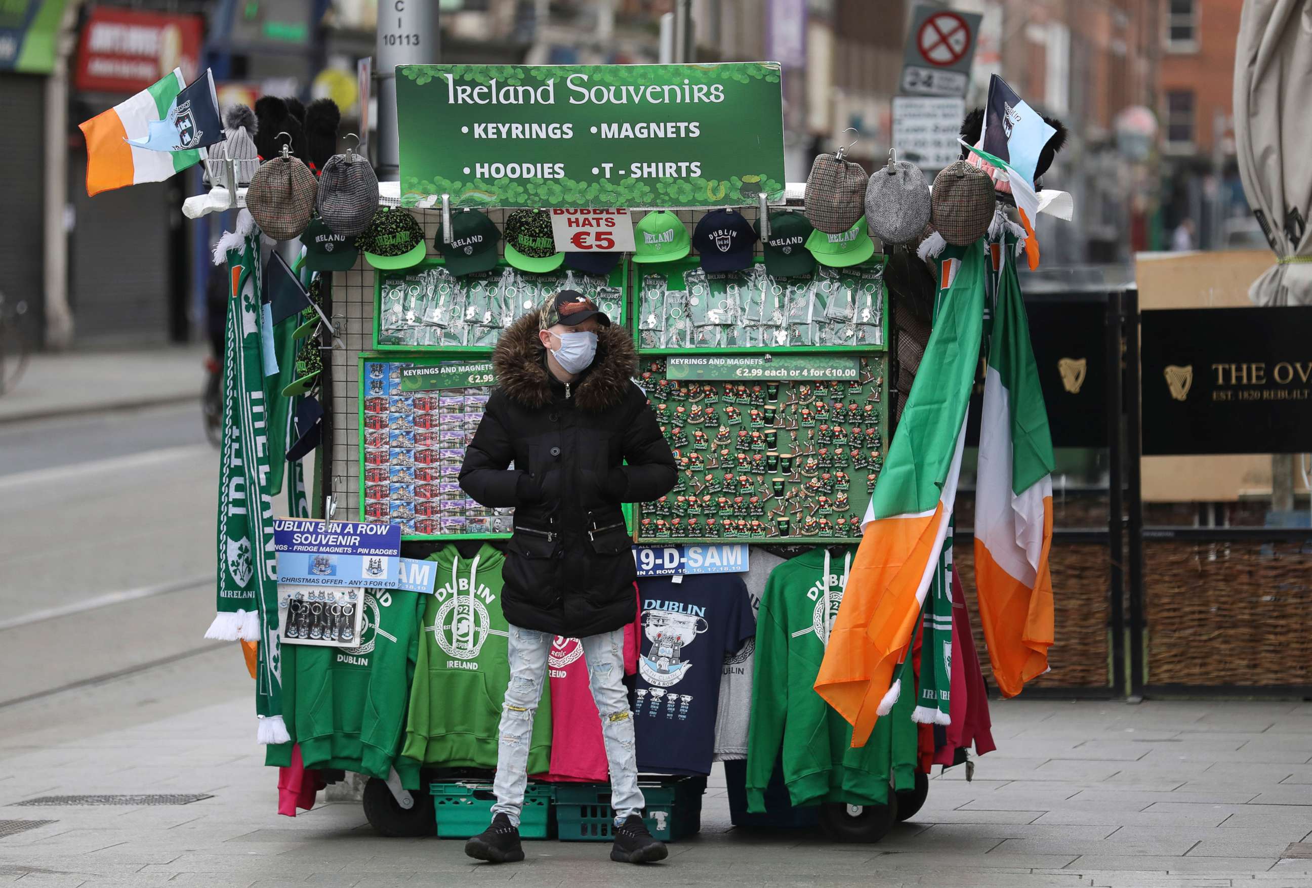 PHOTO: A souvenir seller waits for business in Dublin, March 17, 2020. The St Patrick's Day parades across Ireland were cancelled due to the outbreak of coronavirus.