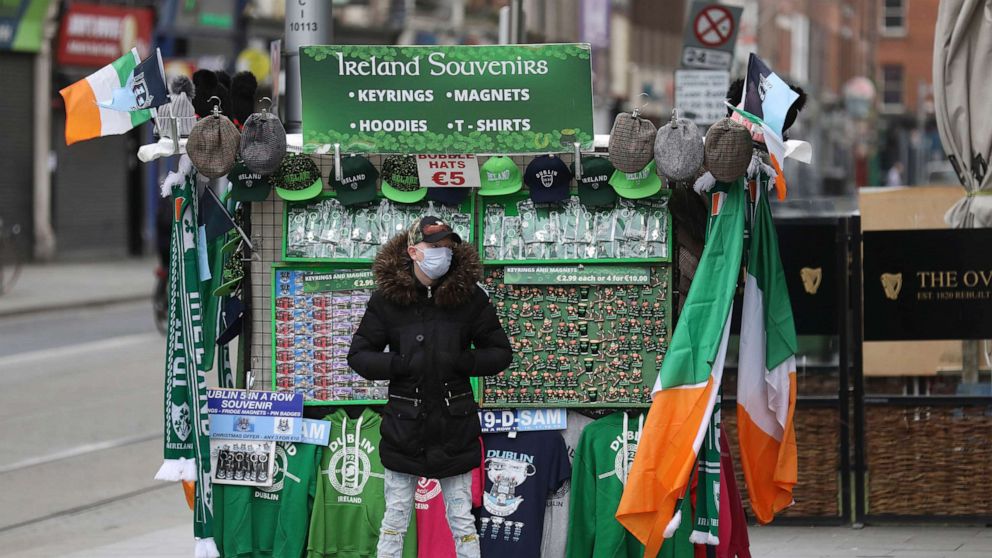 PHOTO: A souvenir seller waits for business in Dublin, March 17, 2020. The St Patrick's Day parades across Ireland were cancelled due to the outbreak of coronavirus.