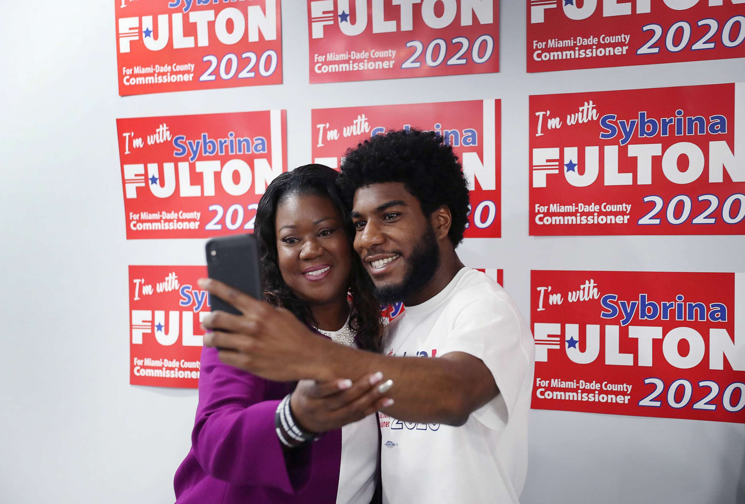 PHOTO: Sybrina Fulton takes a picture with her son, Jahvaris Fulton, after announcing her run for Miami-Dade County commissioners, May 20, 2019, in Miami Gardens, Fla.