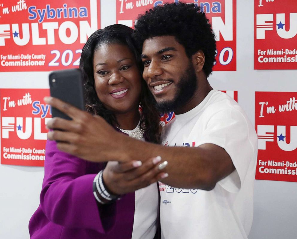 PHOTO: Sybrina Fulton takes a picture with her son, Jahvaris Fulton, after announcing her run for Miami-Dade County commissioners, May 20, 2019, in Miami Gardens, Fla.